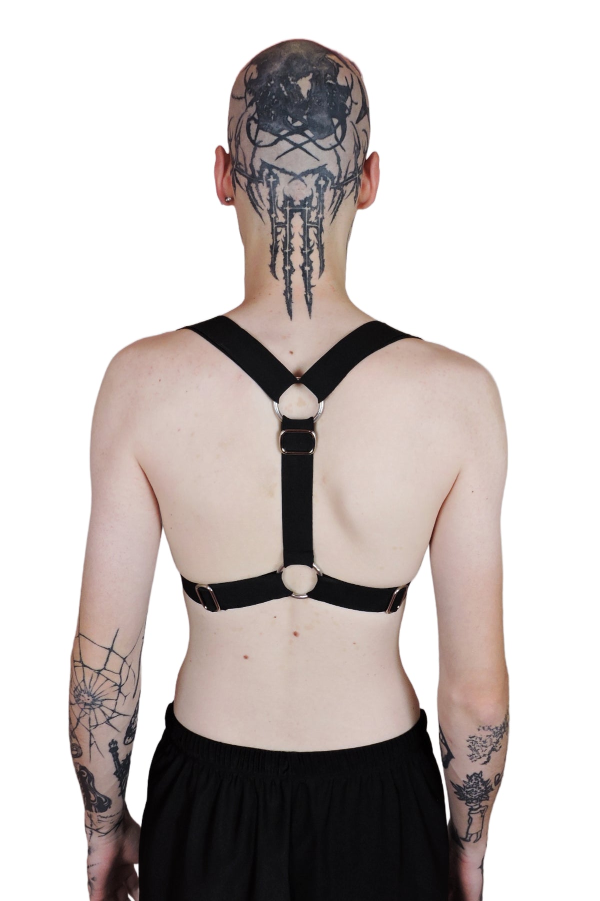 Adjustable men's harness designed to be worn two ways, with bold straps and durable construction for rave wear. Back view