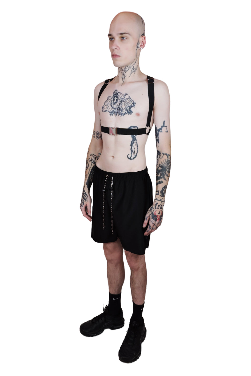 Adjustable men's harness designed to be worn two ways, with bold straps and durable construction for rave wear. Front view