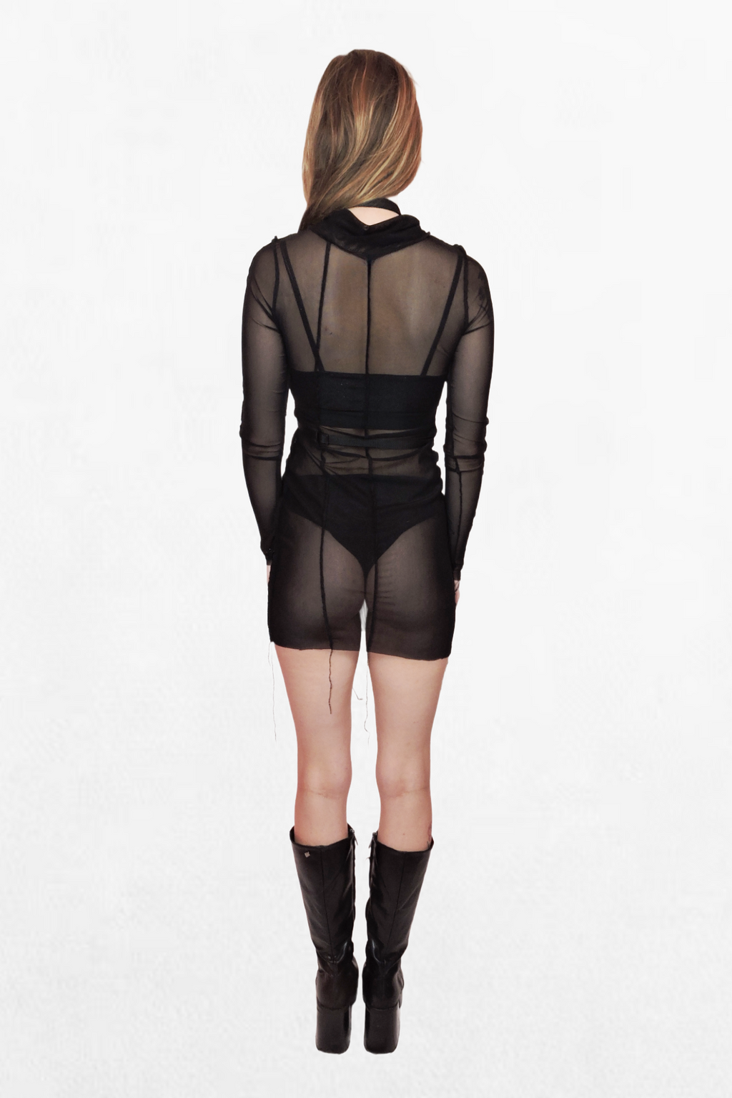 Close-up of a black webbing harness featuring a high choker-style neckline and a waist strap. Silver metal accents, including rings and buckles, create a striking alternative fashion look.