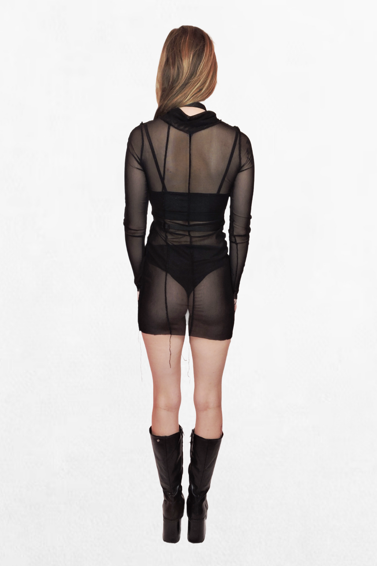 Close-up of a black webbing harness featuring a high choker-style neckline and a waist strap. Silver metal accents, including rings and buckles, create a striking alternative fashion look.