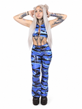 Glossy blue camouflage flared pants styled with a black crop top for an edgy techno clubwear look.