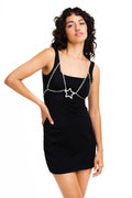 Silver chain bra with star closure.