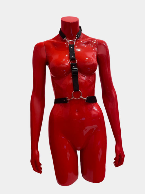 A black adjustable harness for men or women, featuring sleek straps and a versatile design for a bold and stylish look.