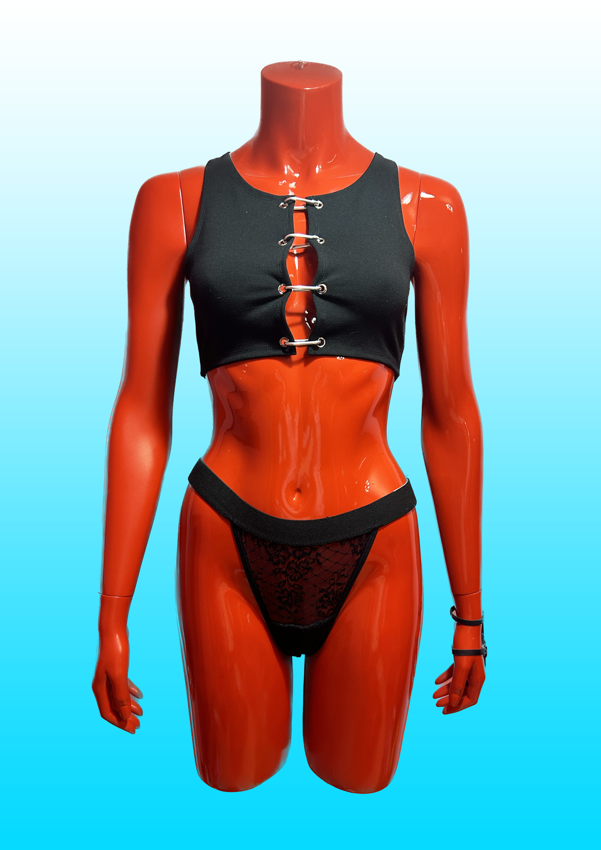 Black crop top with silver carabiner closures.