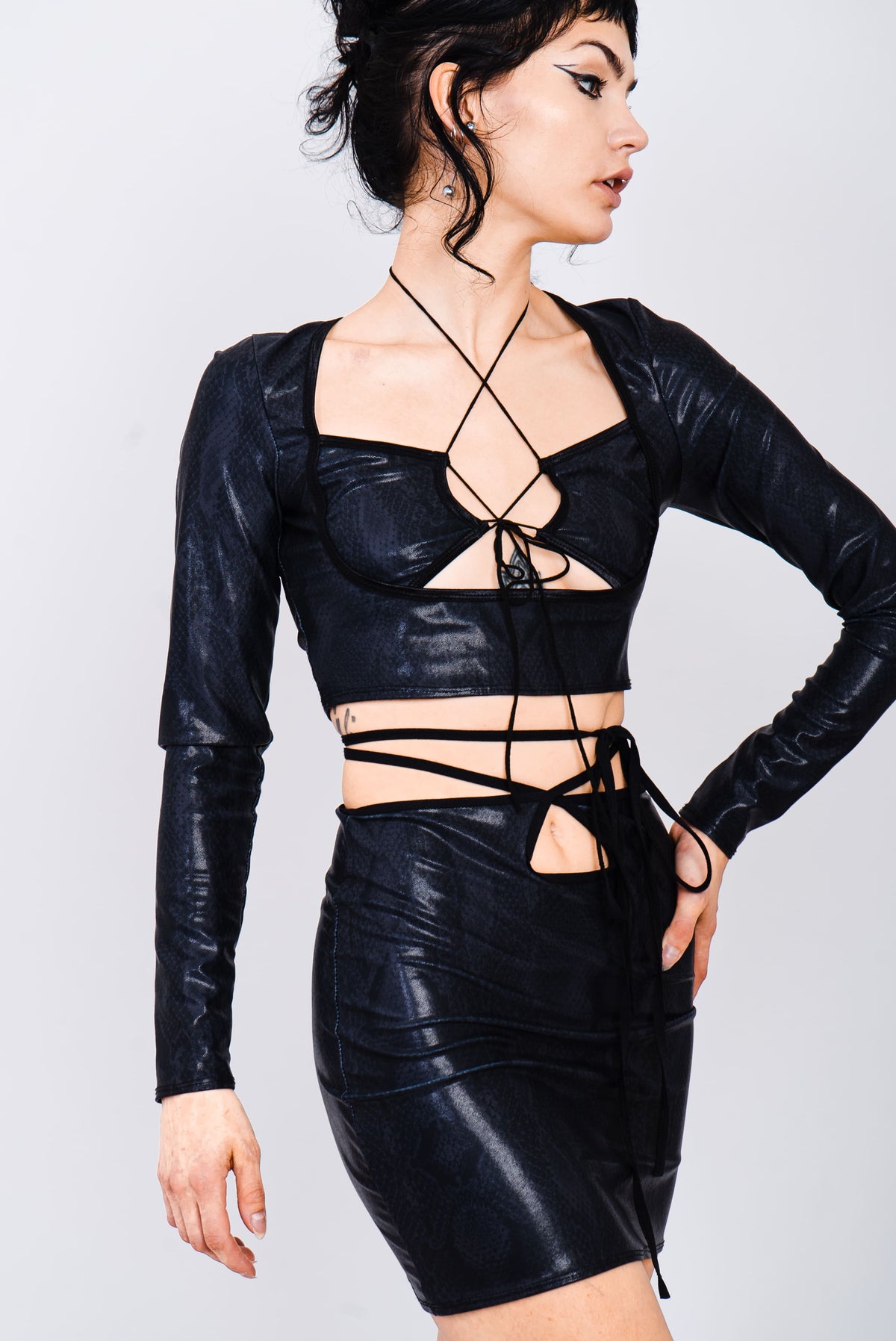 Black snake print mini skirt with keyhole cutout.