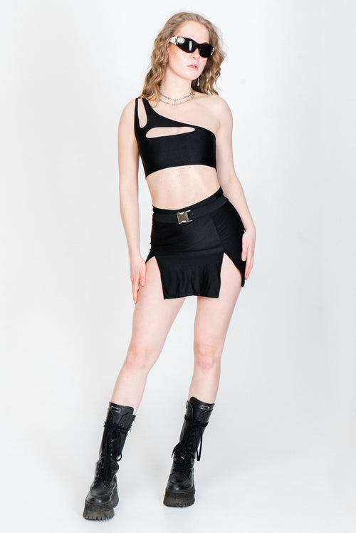 Strappy black top with asymmetric cutouts for raving.