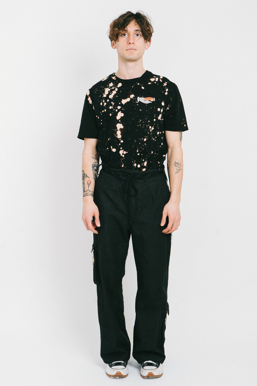 Black cotton bleached men's tshirt with a tatoo style patch.