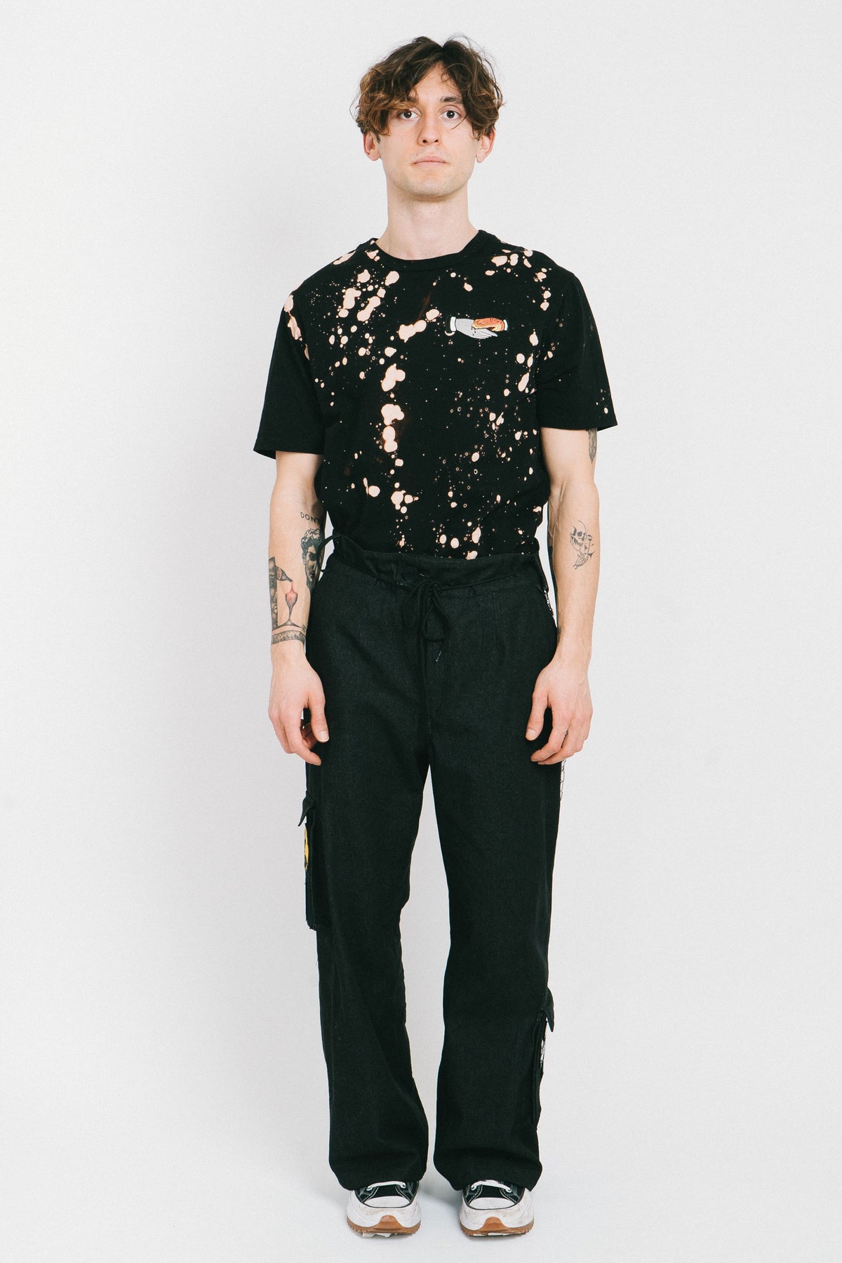 Black cotton bleached men's tshirt with a tatoo style patch.