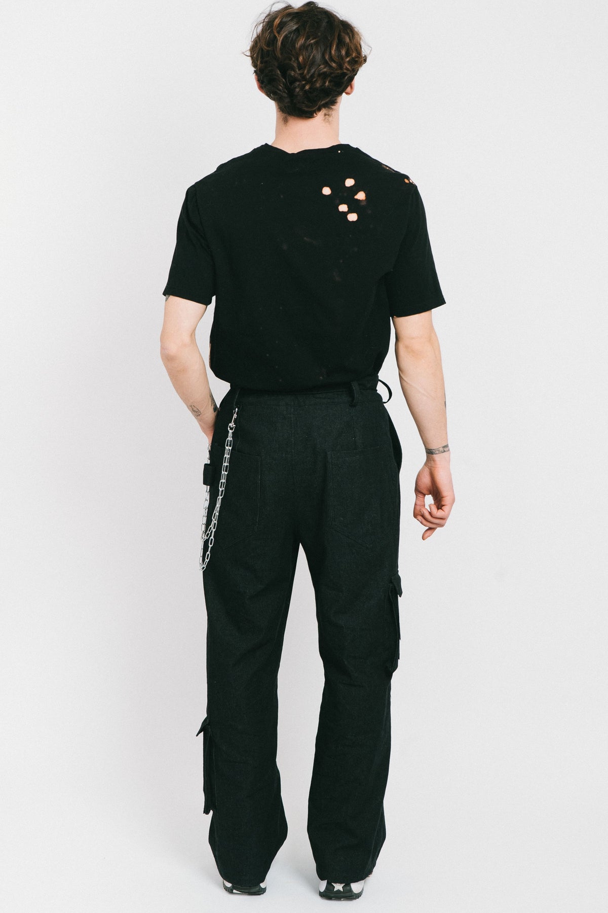 Black cotton bleached men's tshirt with a tatoo style patch.