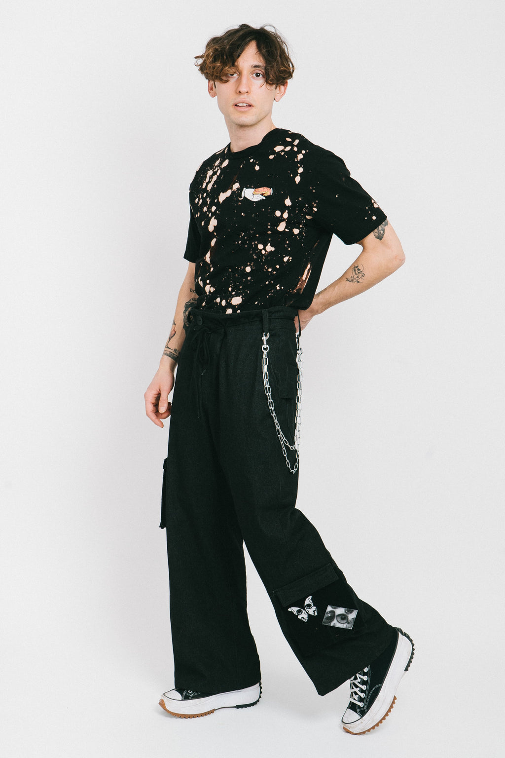 Black cotton bleached men's tshirt with a tatoo style patch.