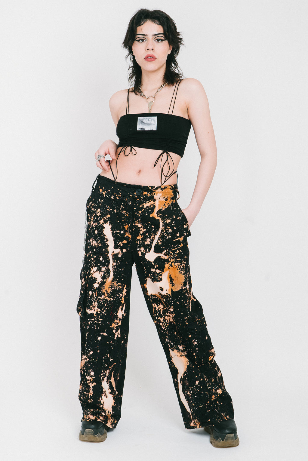 Spatter pattern bleach wide legged trousers.