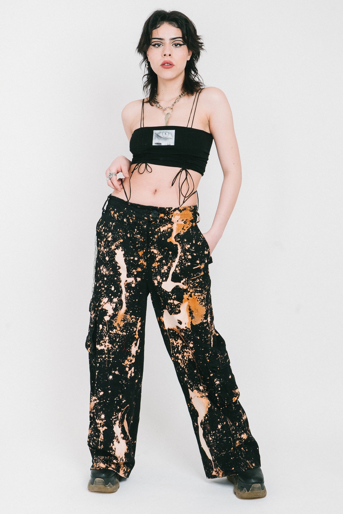 Spatter pattern bleach wide legged trousers.