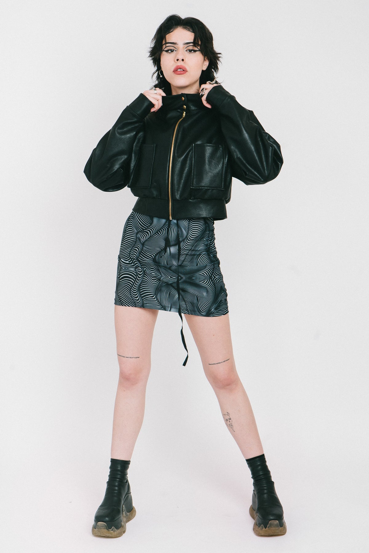 Vegan leather jacket with smileys on the back and red lining from IVY Berlin