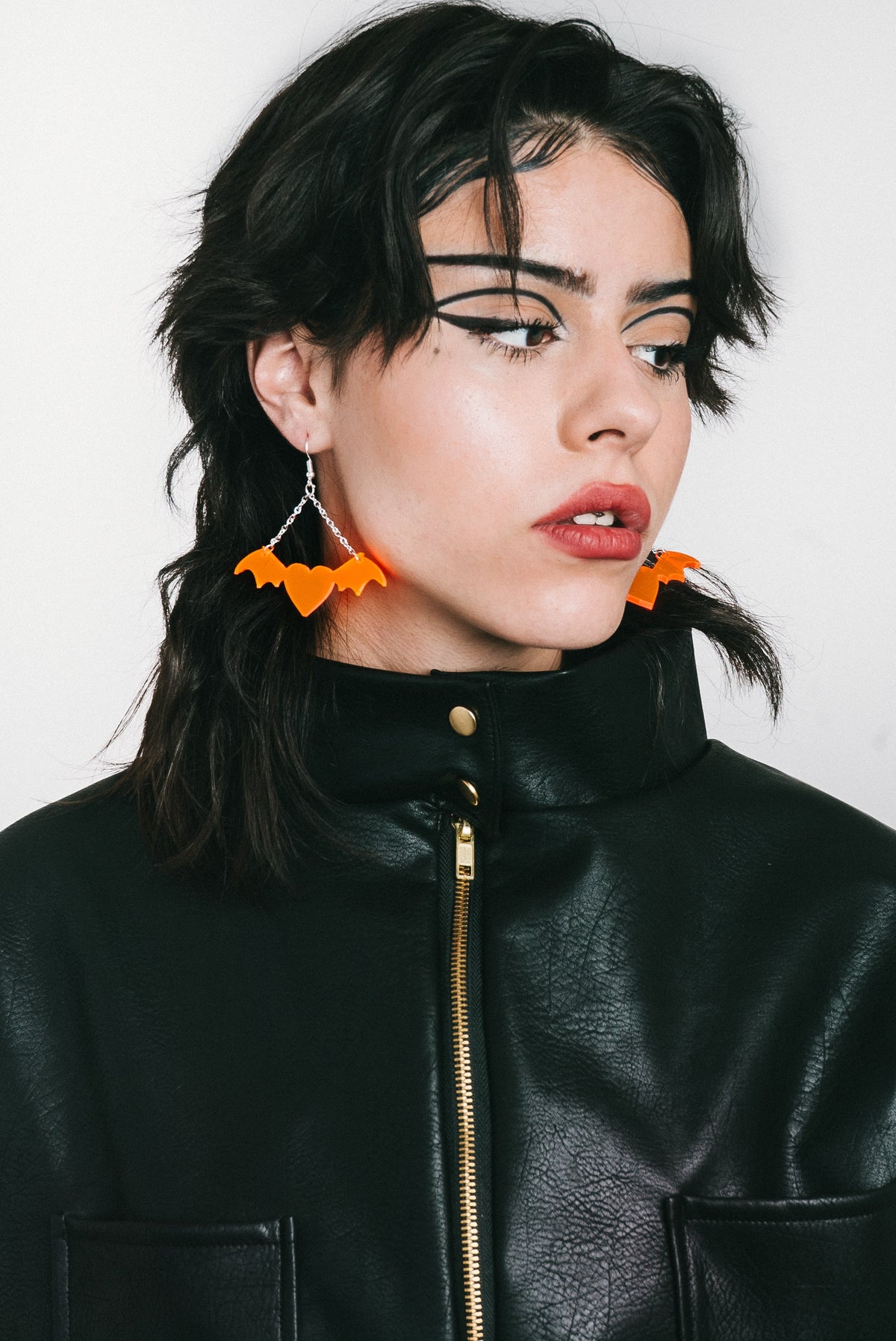 Vegan leather jacket with smileys on the back and red lining from IVY Berlin