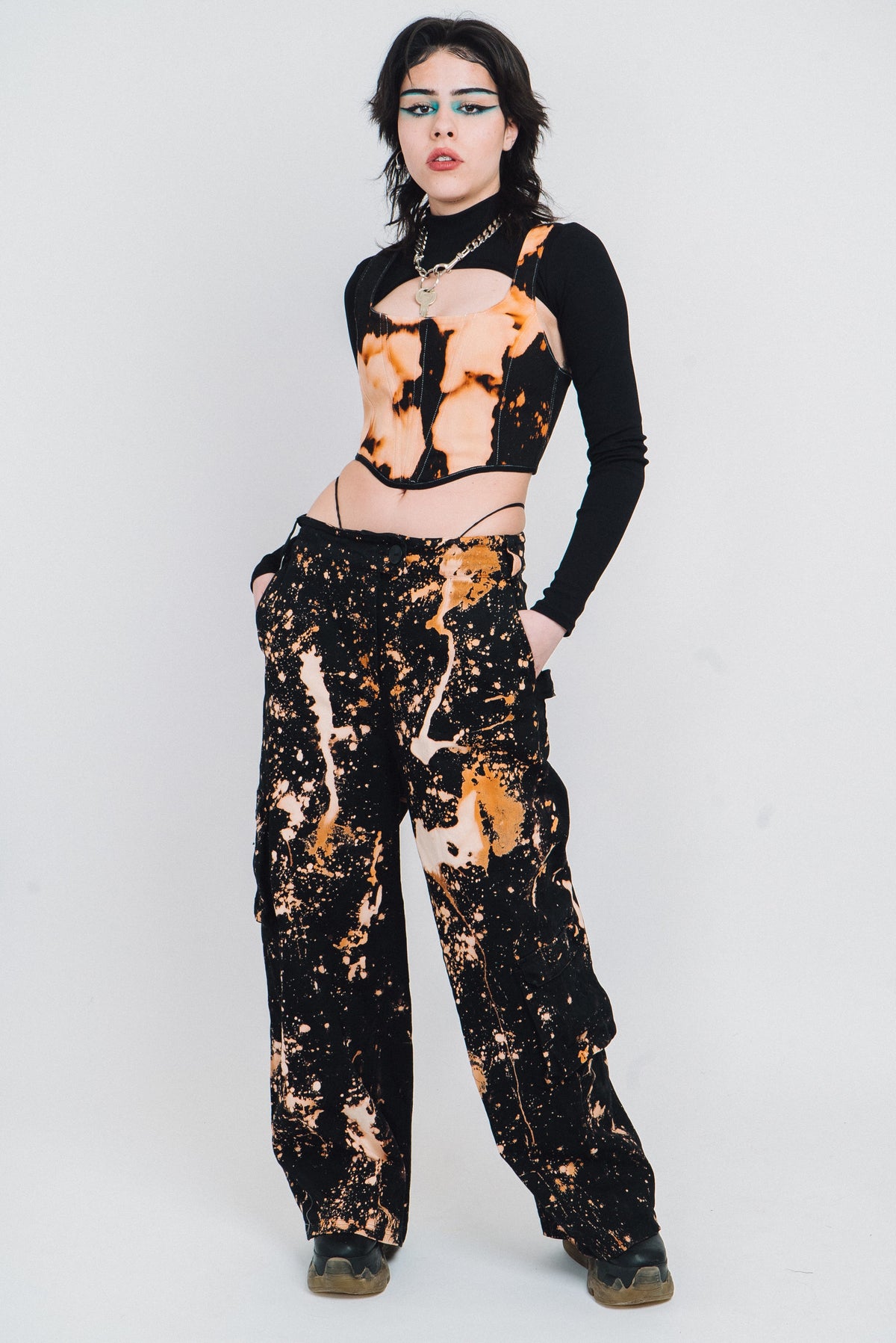 Spatter pattern bleach wide legged trousers.