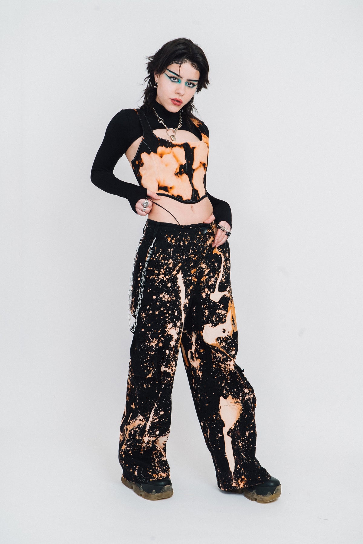 Spatter pattern bleach wide legged trousers.