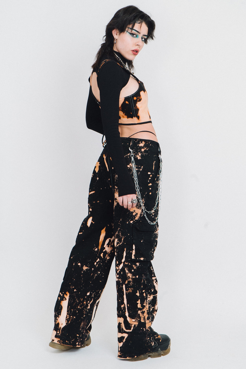 Spatter pattern bleach wide legged trousers.