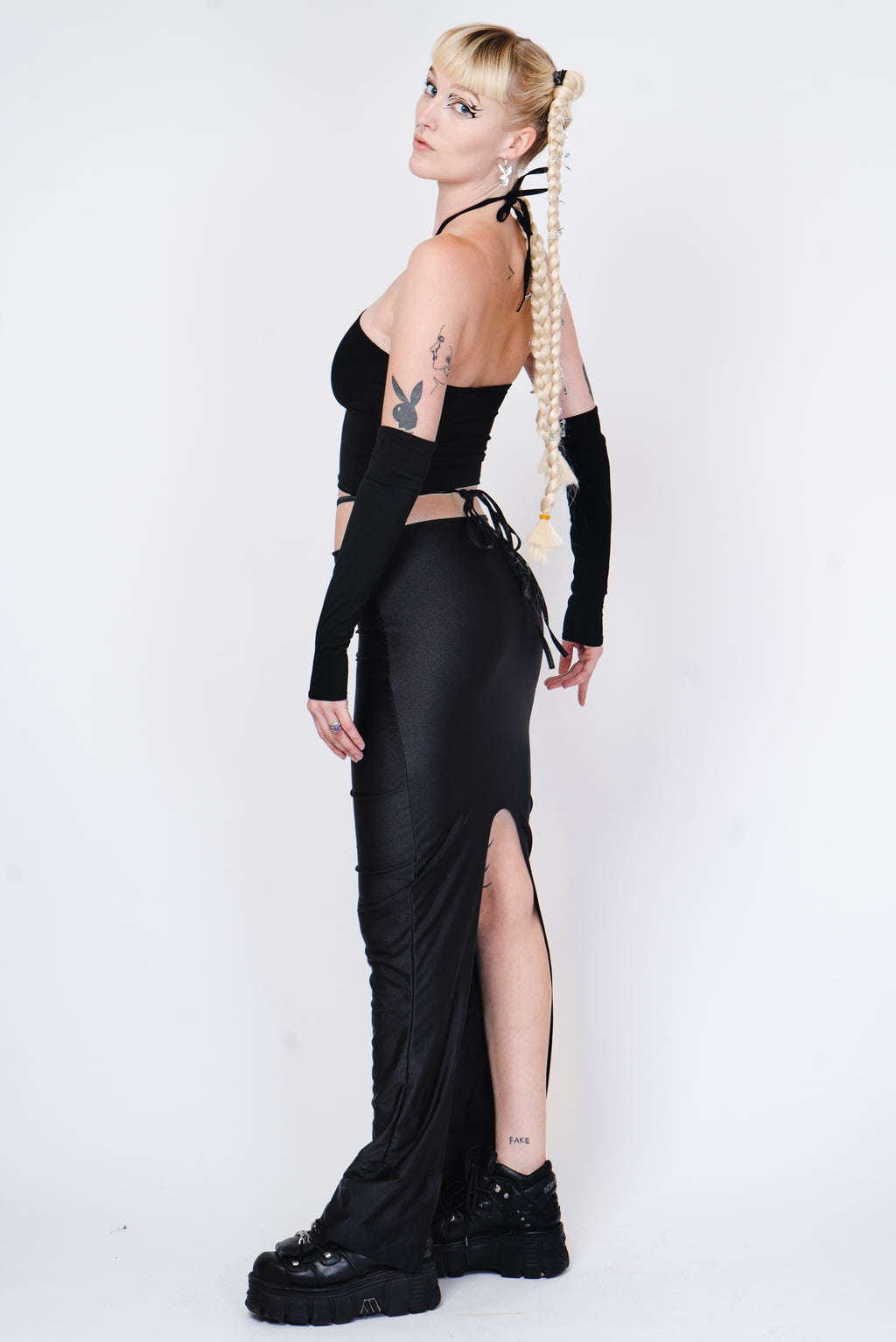 Black crop top with silver ring and matching sleeves.