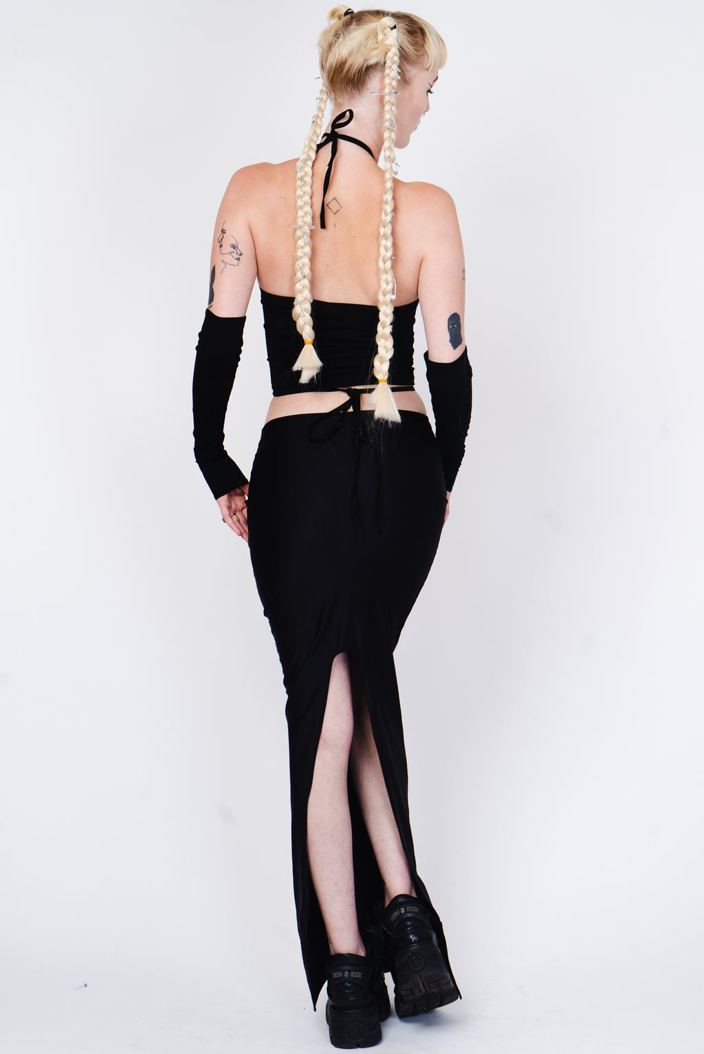 Black crop top with silver ring and matching sleeves.