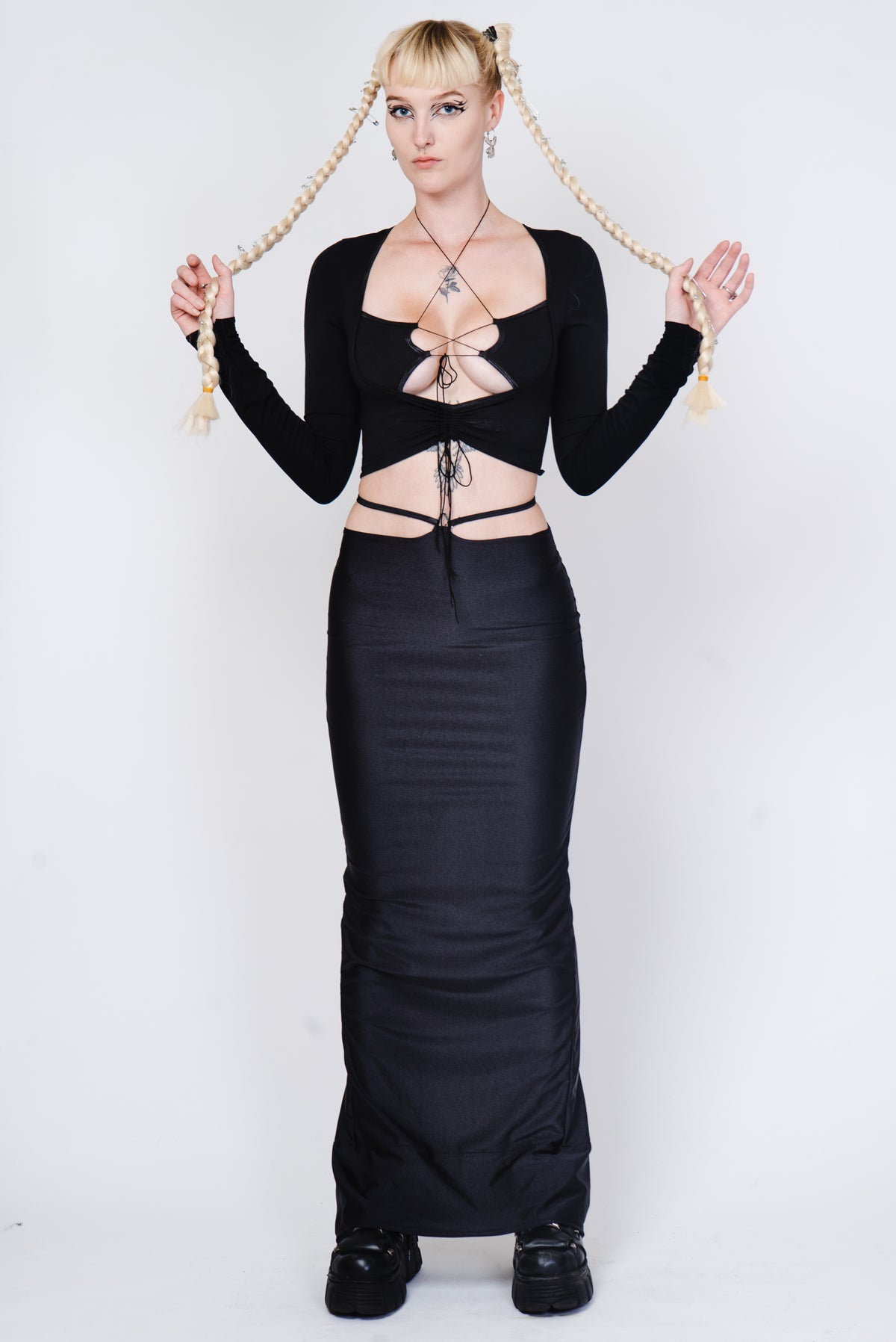 Black cotton longsleeve top with strappy details.