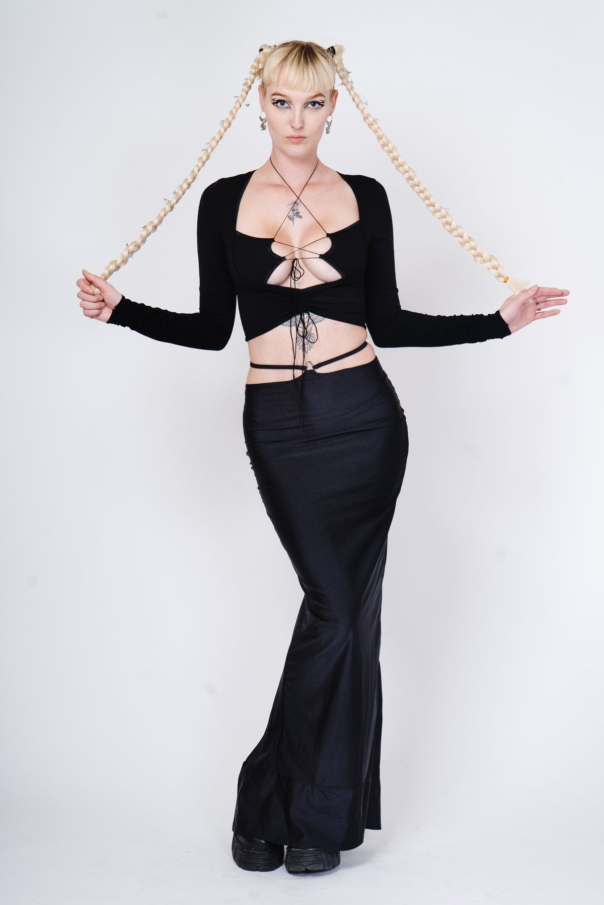 Black cotton longsleeve top with strappy details.