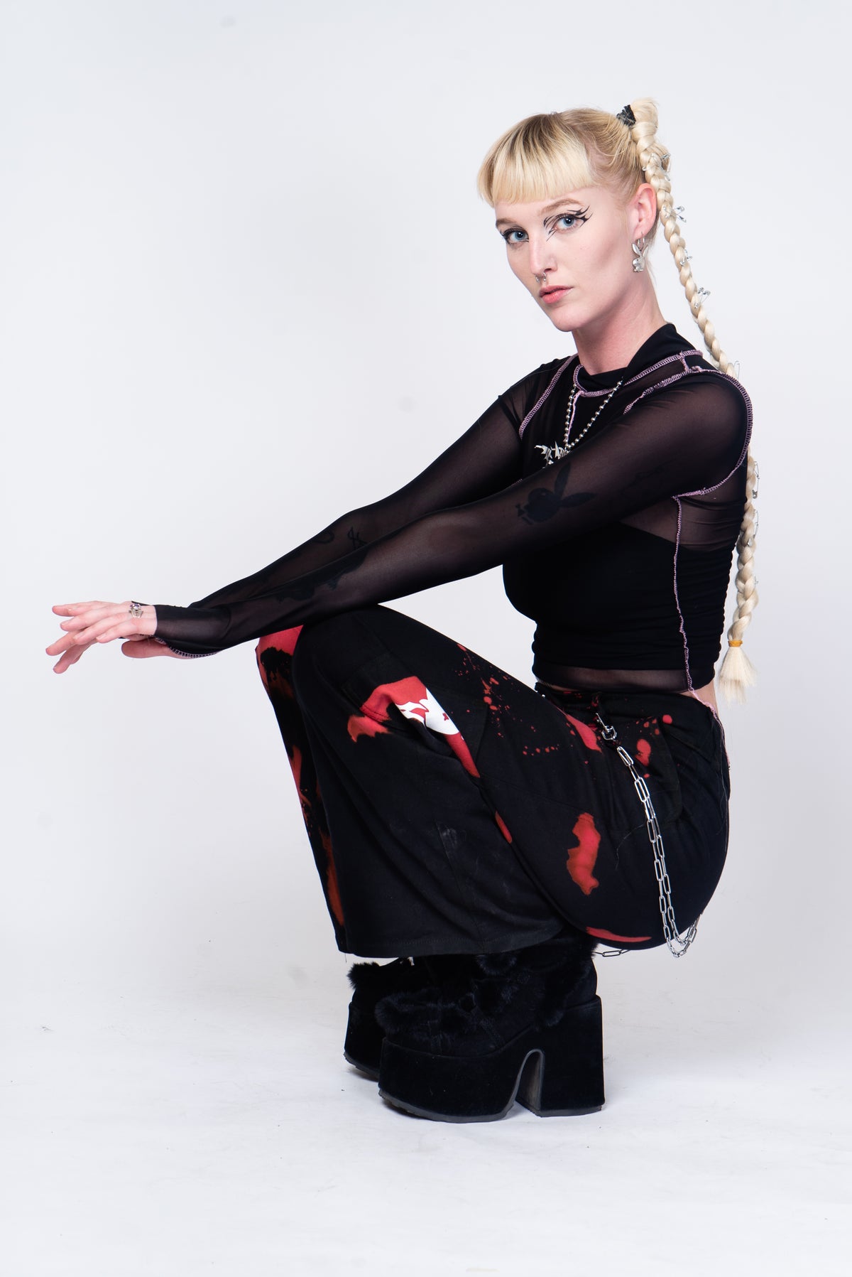 Black mesh see through top with pink and silver details.
