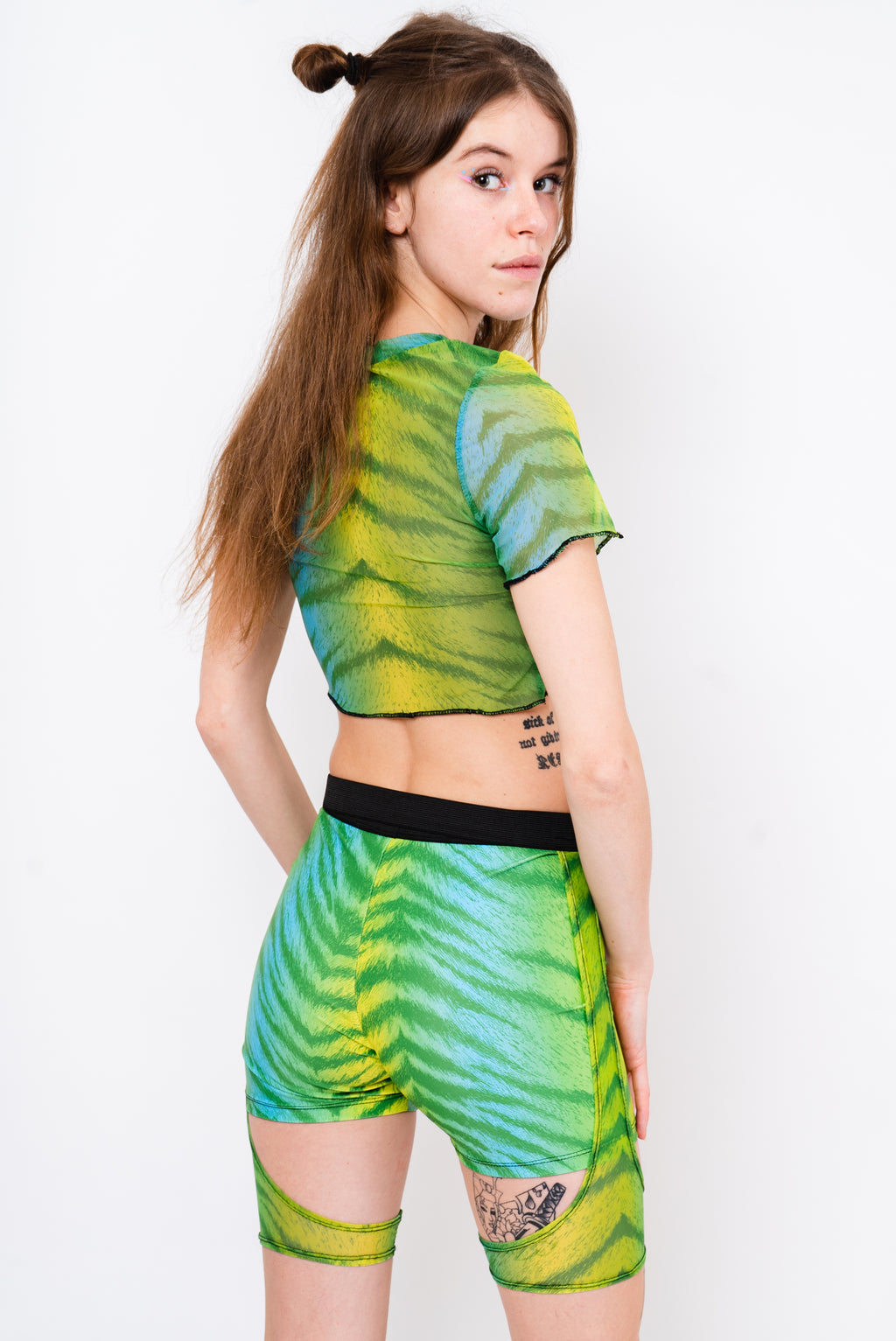 Neon green and black layered shorts.