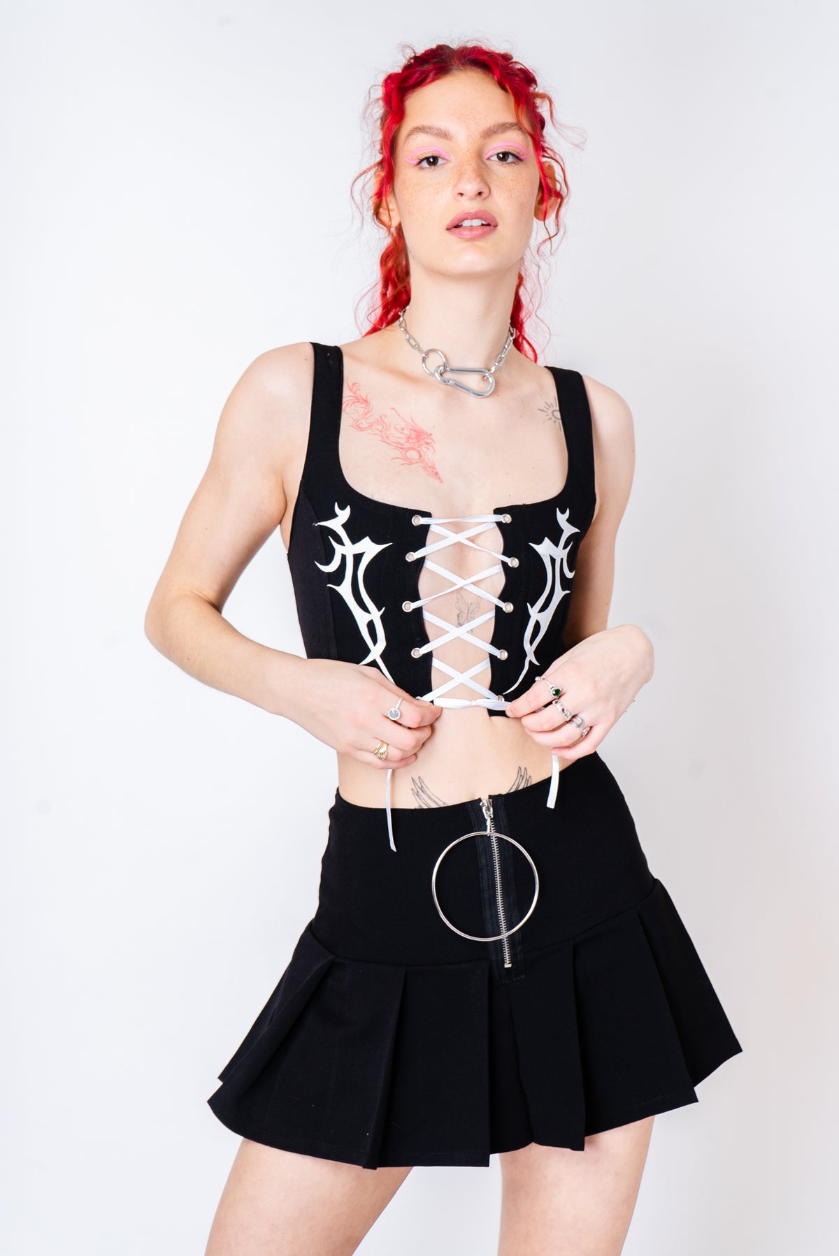 Black corset with lacing in the front and tribal print.