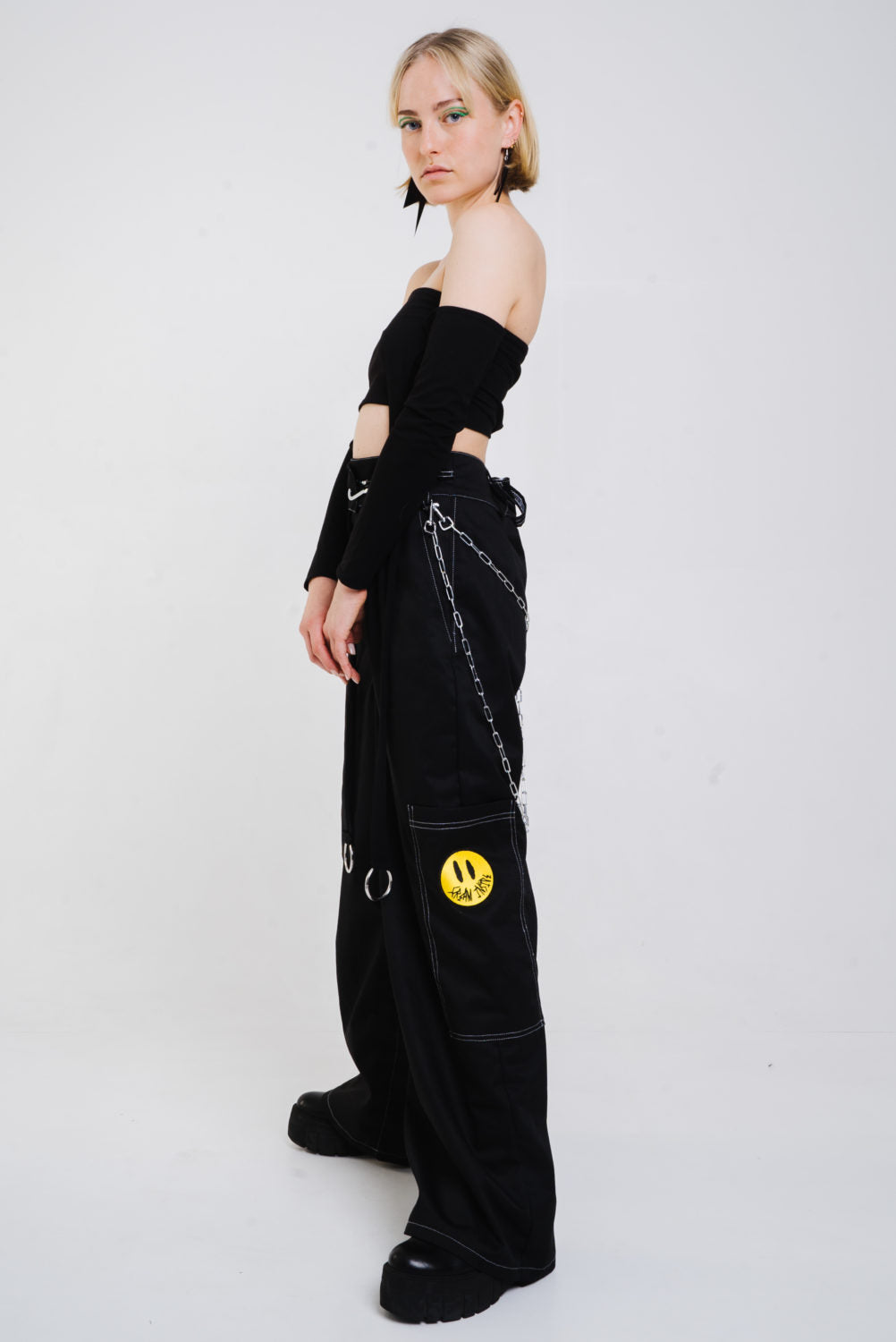 Black wide cut trousers with chain detail.