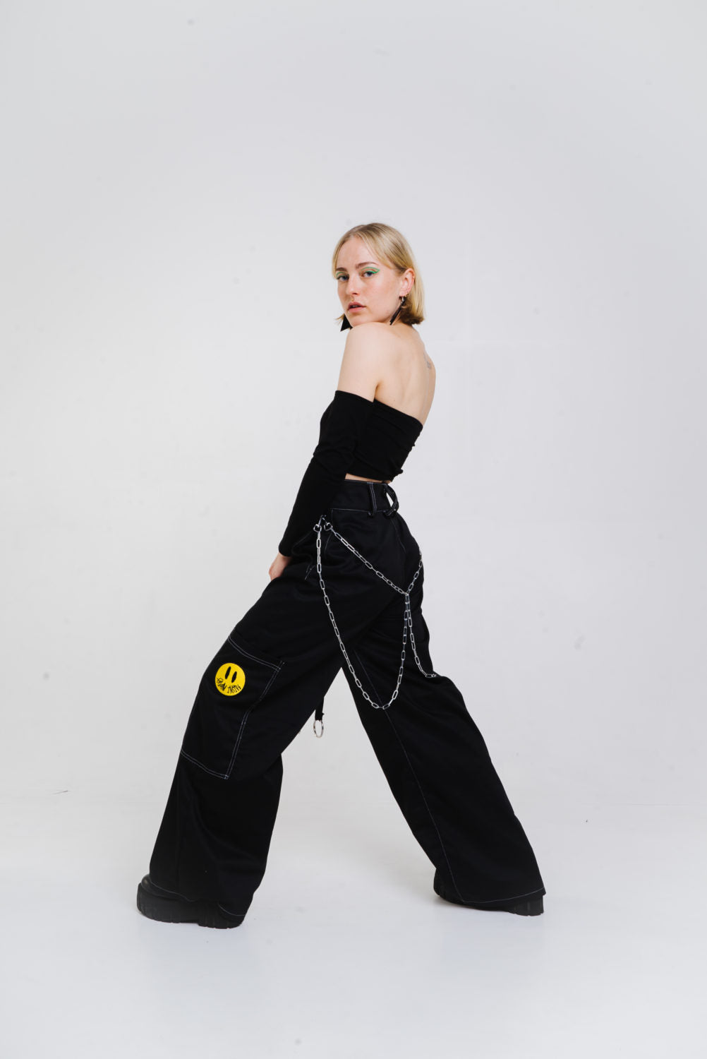 Black wide cut trousers with chain detail.